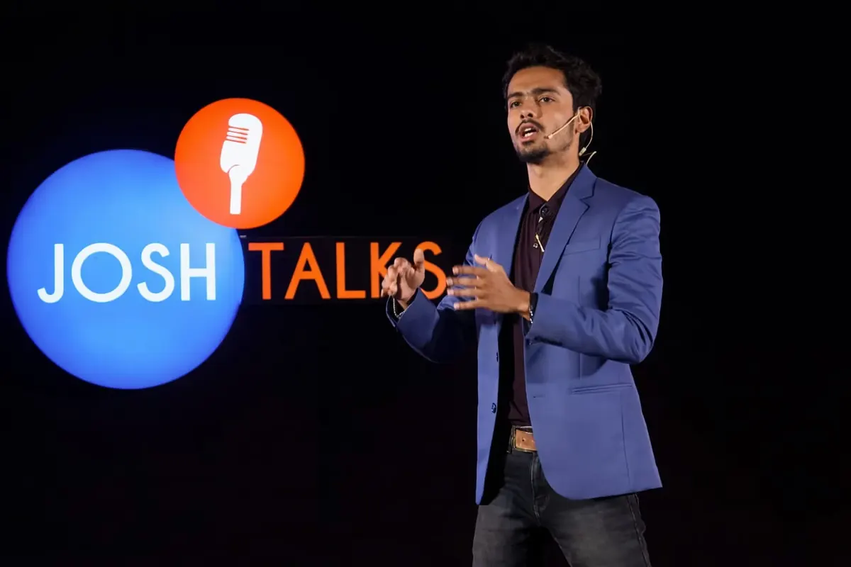 Abhra Das speaking on stage at Josh Talks